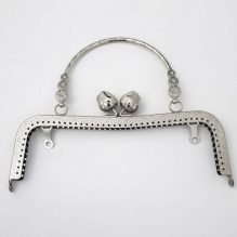 A Frame With A Metal Handle With A Metal Clip For A Wallet In The Shape Of A Flower