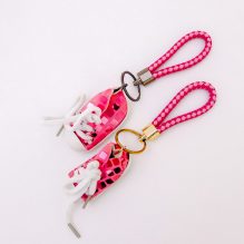 Medal in the form of pink shoes for bags