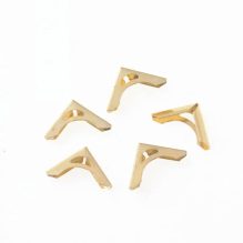 Antique Corner Protectors A piece of gold metal for book and album corners